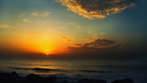 Amazing Beautiful Yellow Sunset and waves on the sea