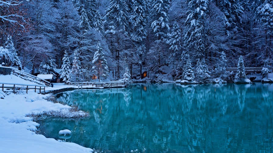 Beautiful Blue Lake Snowed Forest and House