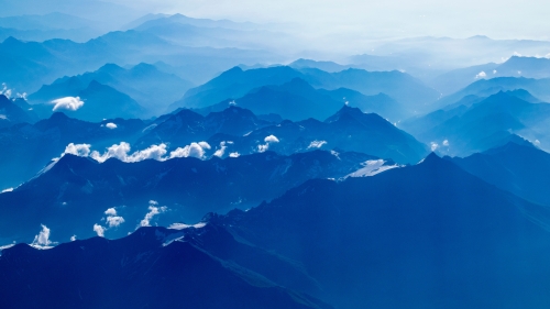 Beautiful Dark Blue Mountain Valley and Clouds