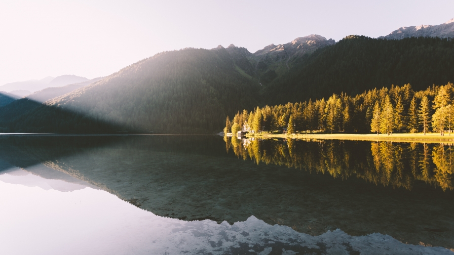 Beautiful Lake in Mountain Valley and Single House on Shore