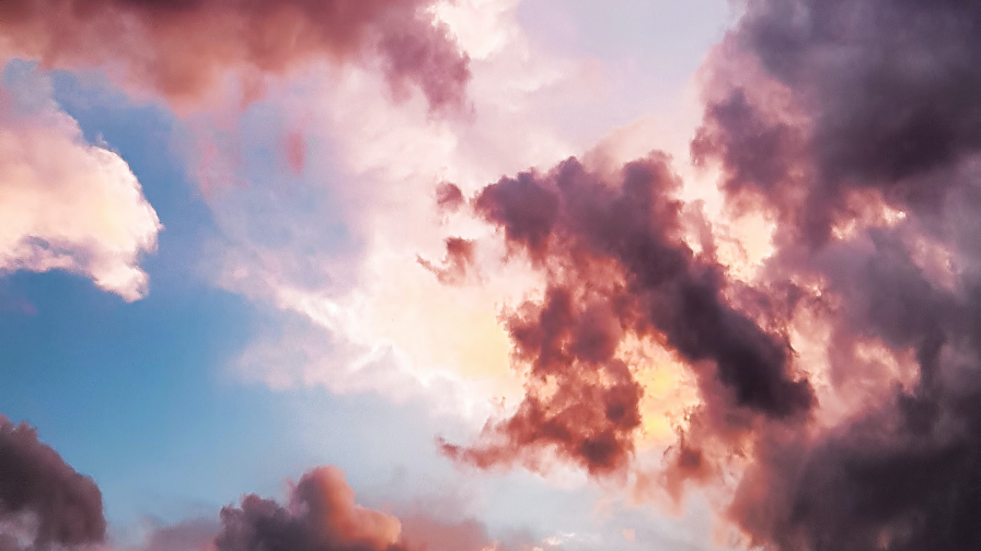 Beautiful Purple Clouds in Sky and Sunlight