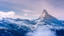 Beautiful Snowed Mountain Peak and Clouds