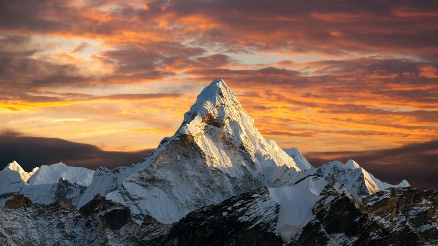 Beautiful Snowed Mountain Peak and Sunset