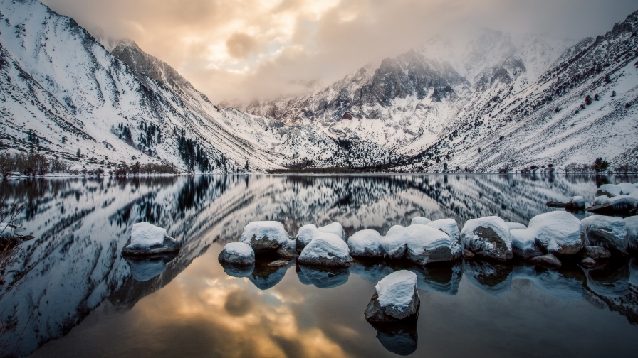 Beautiful Snowed Mountains and Rocks in Water