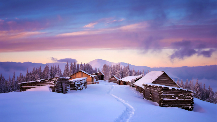 Beautiful Snowed Village and Purple Sunset