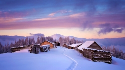 Beautiful Snowed Village and Purple Sunset