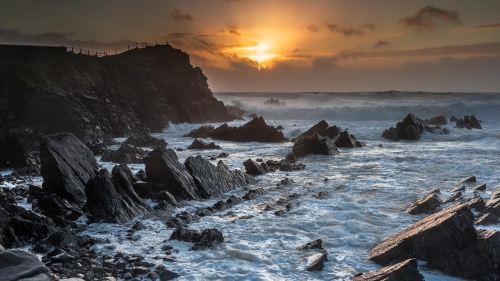 Beautiful Sunset and Waves in Rocks on Coast