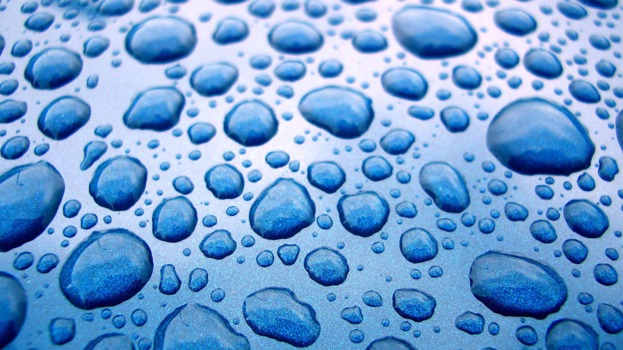 Beautiful Water Drops on Glass and Blue Light