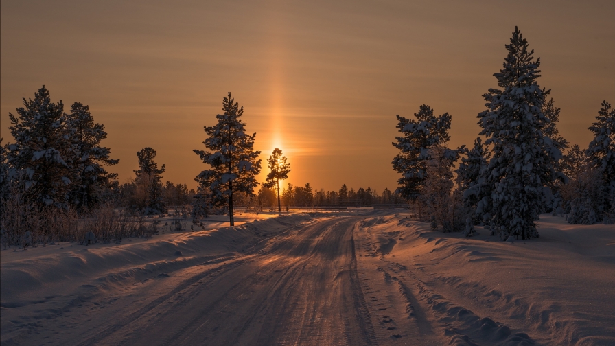 Beautiful Winter Snowed Road and Sunset