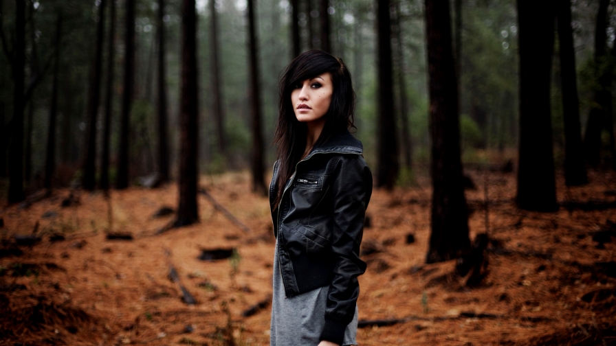 Beautiful Young Sad Girl in Autumn Forest