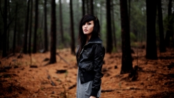 Beautiful Young Sad Girl in Autumn Forest