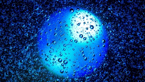 Blue Drops and Bubbles on Glass Surface
