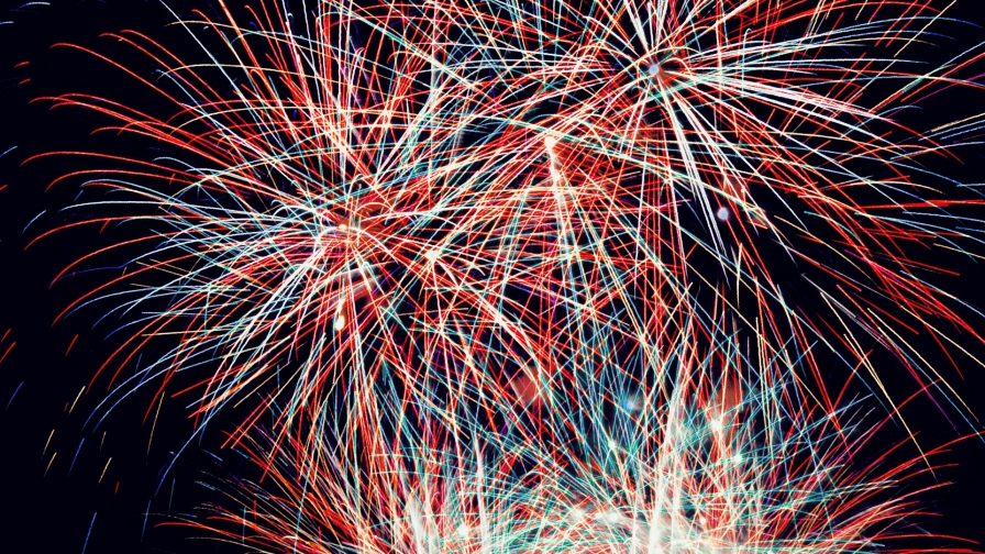 Many colorful fireworks in the night sky