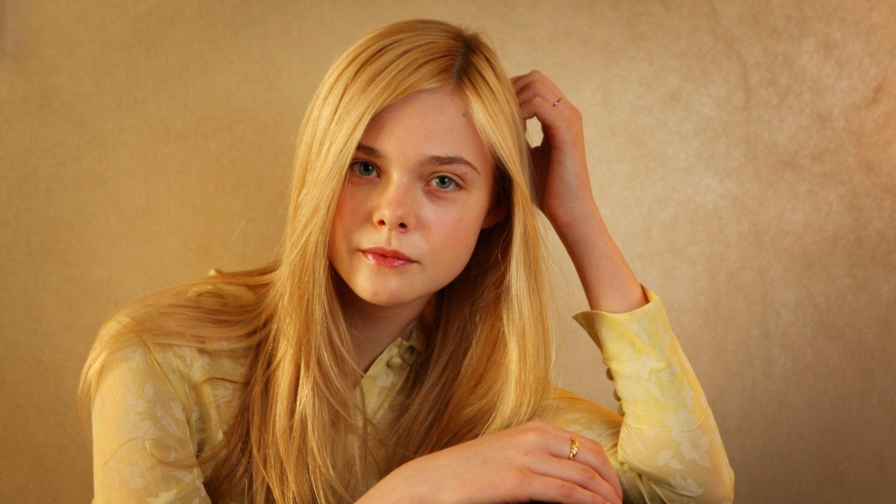 Mary Elle Fanning with Background of Yellow Concrete