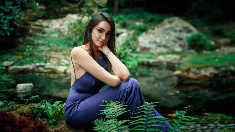 Pretty Young Girl in Blue Dress in Forest