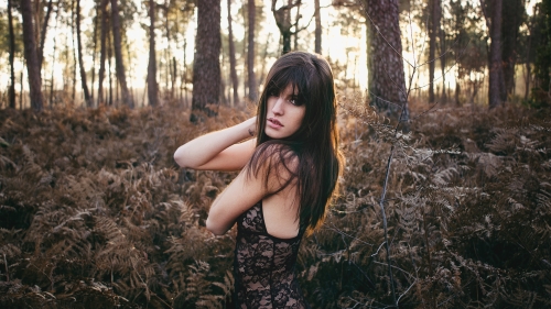 Pretty Young Sexy Girl and Sunlight in Forest