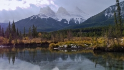 Rocks in Mountain Valley and Reflection on Lake