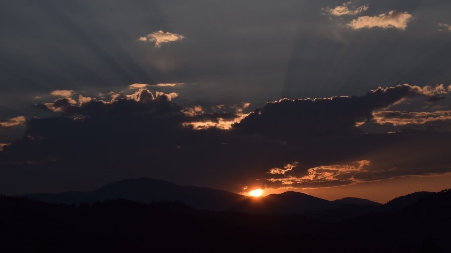 Silhouette of Mountain Under Cloudy Sky