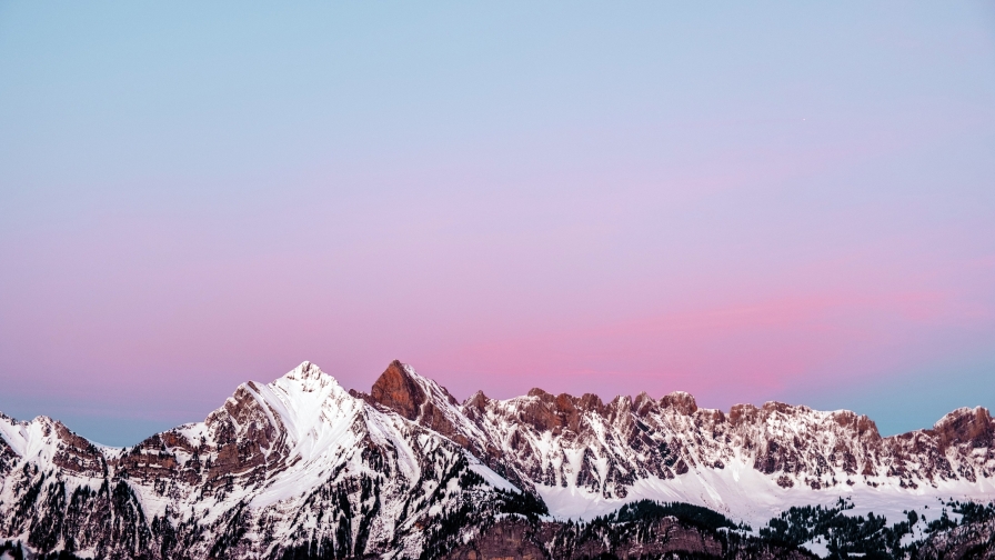 Snowed Mountains Peaks and Purple Sunset Sky