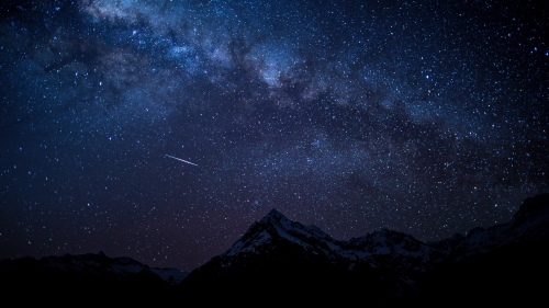 Starry Night Sky and Mountains Peaks