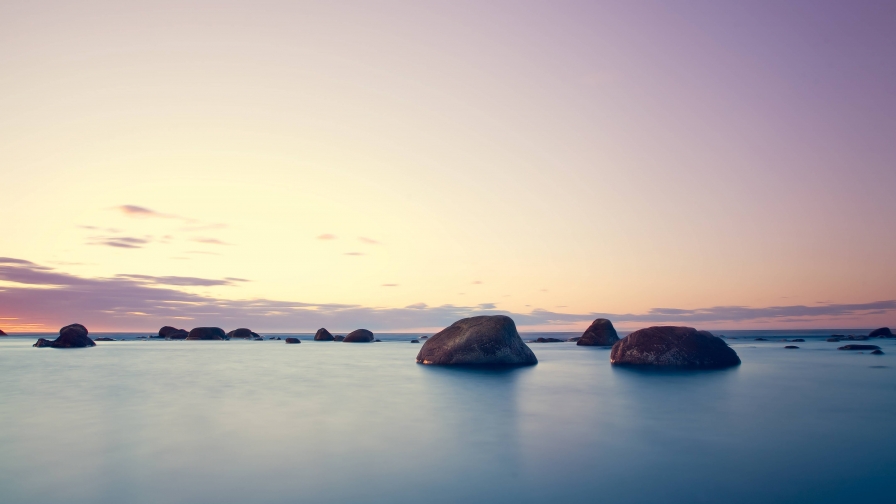 Sunset Purple Sky and Rocks in Water