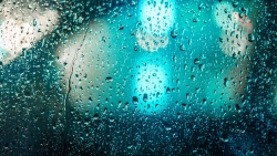 Water Drops on Car Glass and Blue Light