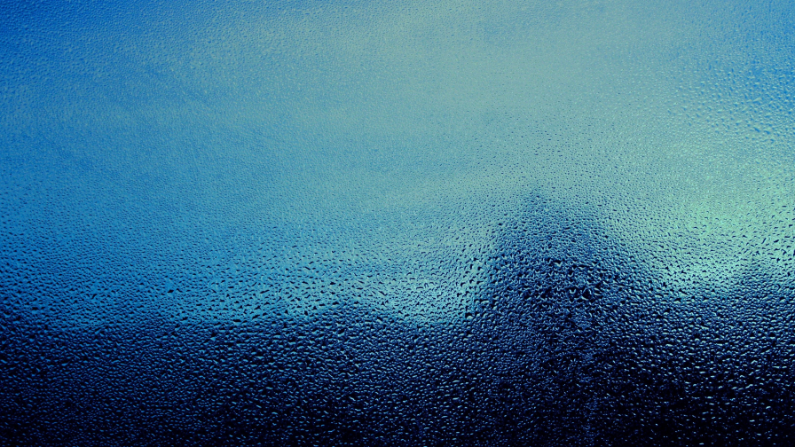 Water Drops on Glass and Blue Light