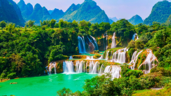Waterfall and Beautiful Green Forest with Village
