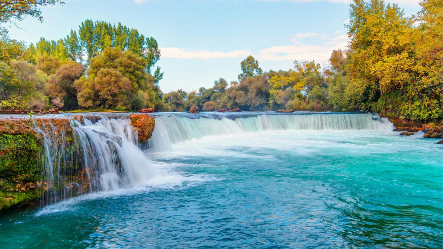 Waterfall Pouring on River Surrounded by Green Trees