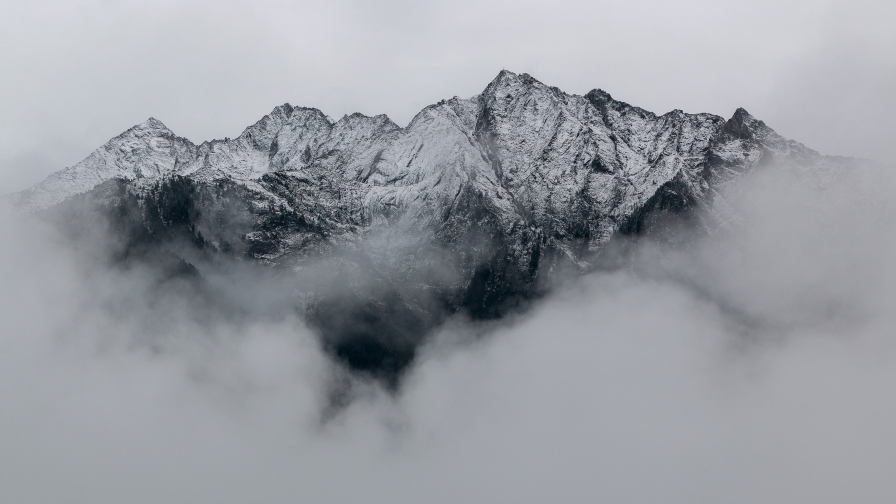 Wonderful Mountains Peaks in Fog