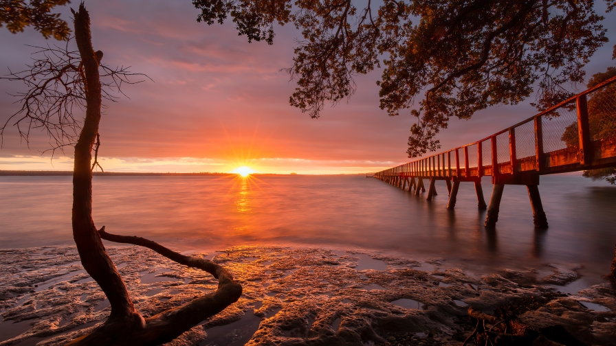 Wonderful Orange Sunset and Bridge with Shore