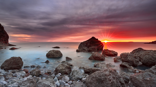 Wonderful Red Sunrise and Rock on Coast