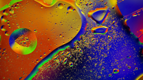 Yellow Blue and Purple Water Drops on Glass