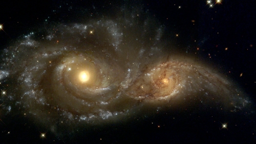 Yellow galaxy and stars in space